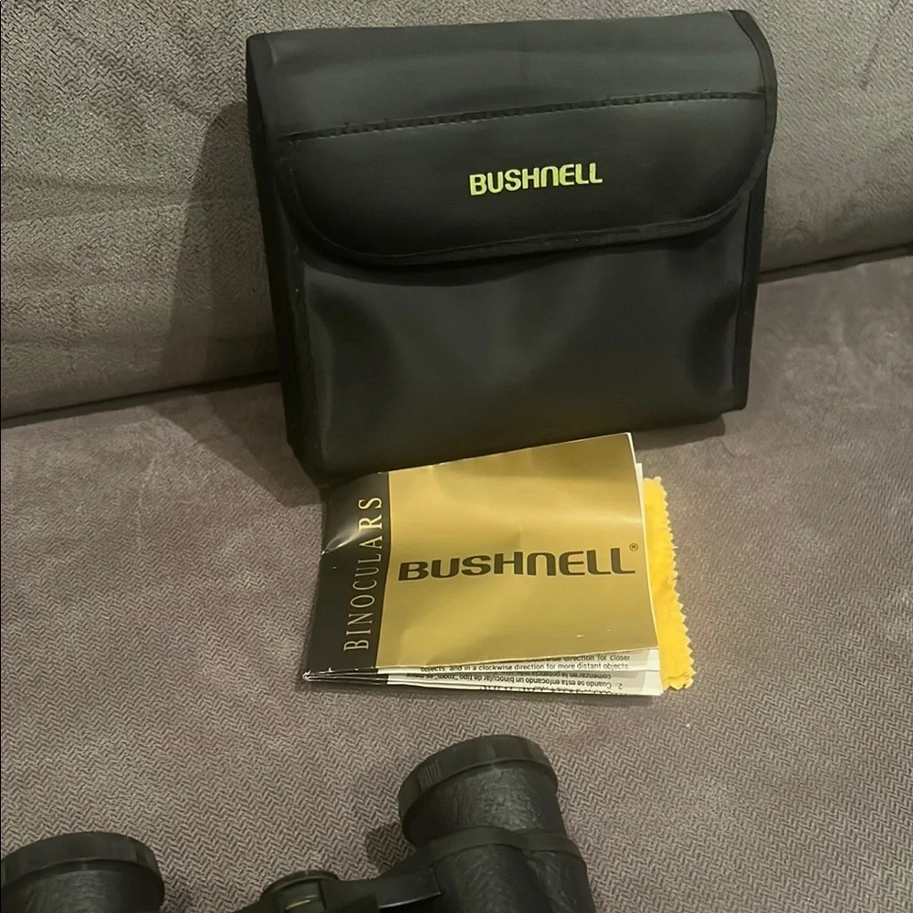 Black Bushnell Binoculars with Rubber Armor and Central Focus